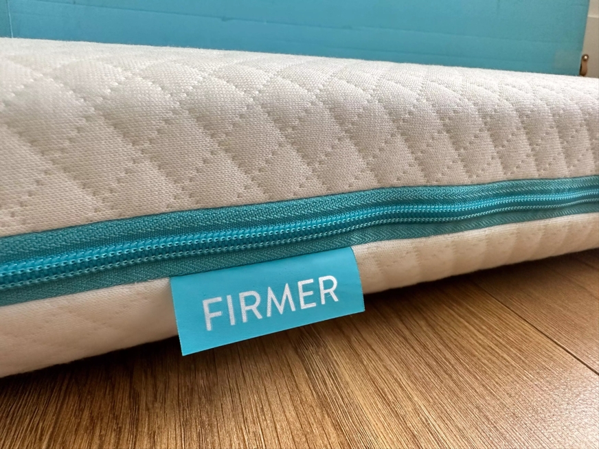 simba cot mattress firmer side label